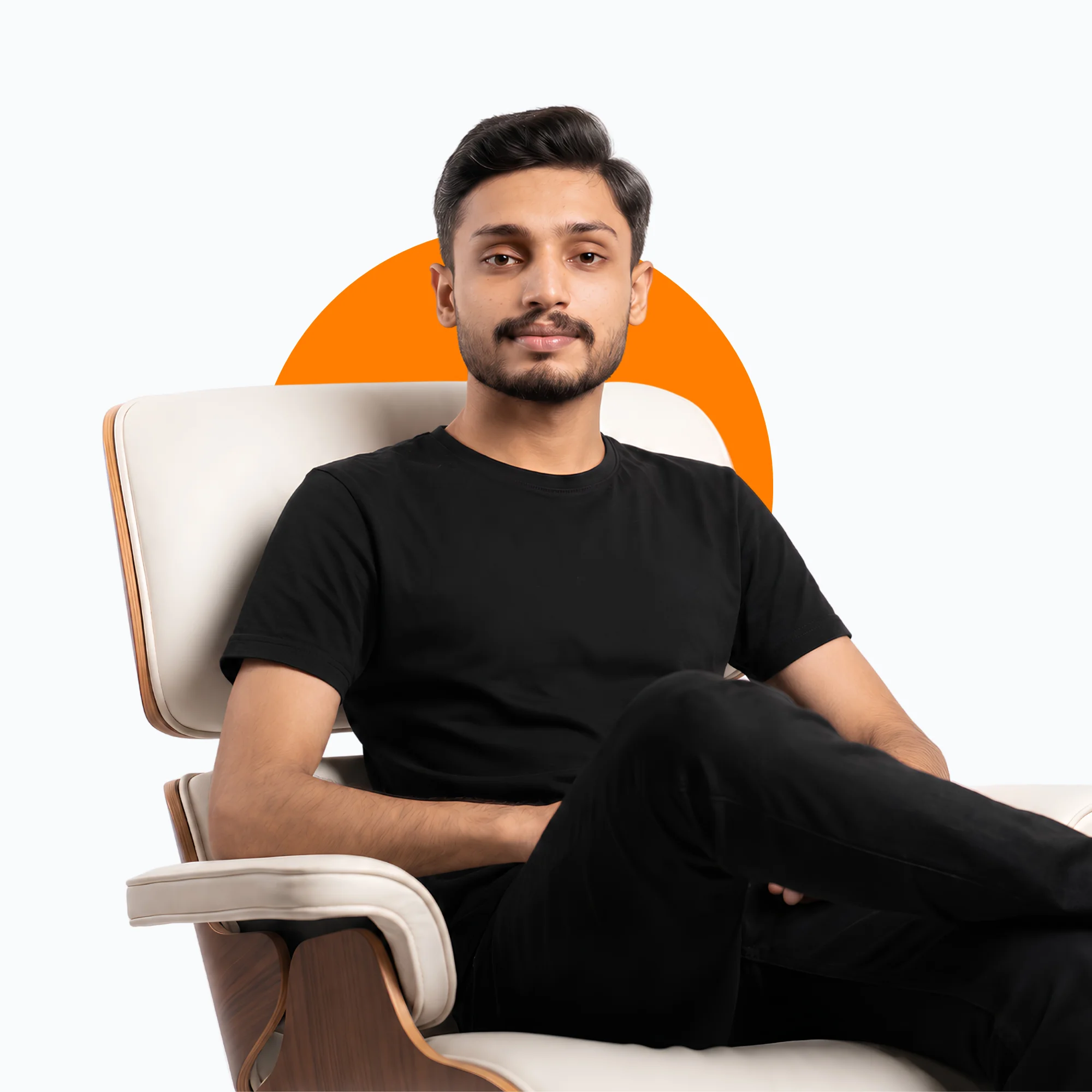 kumail-kazmi-sitting-on-chair-in-his-office